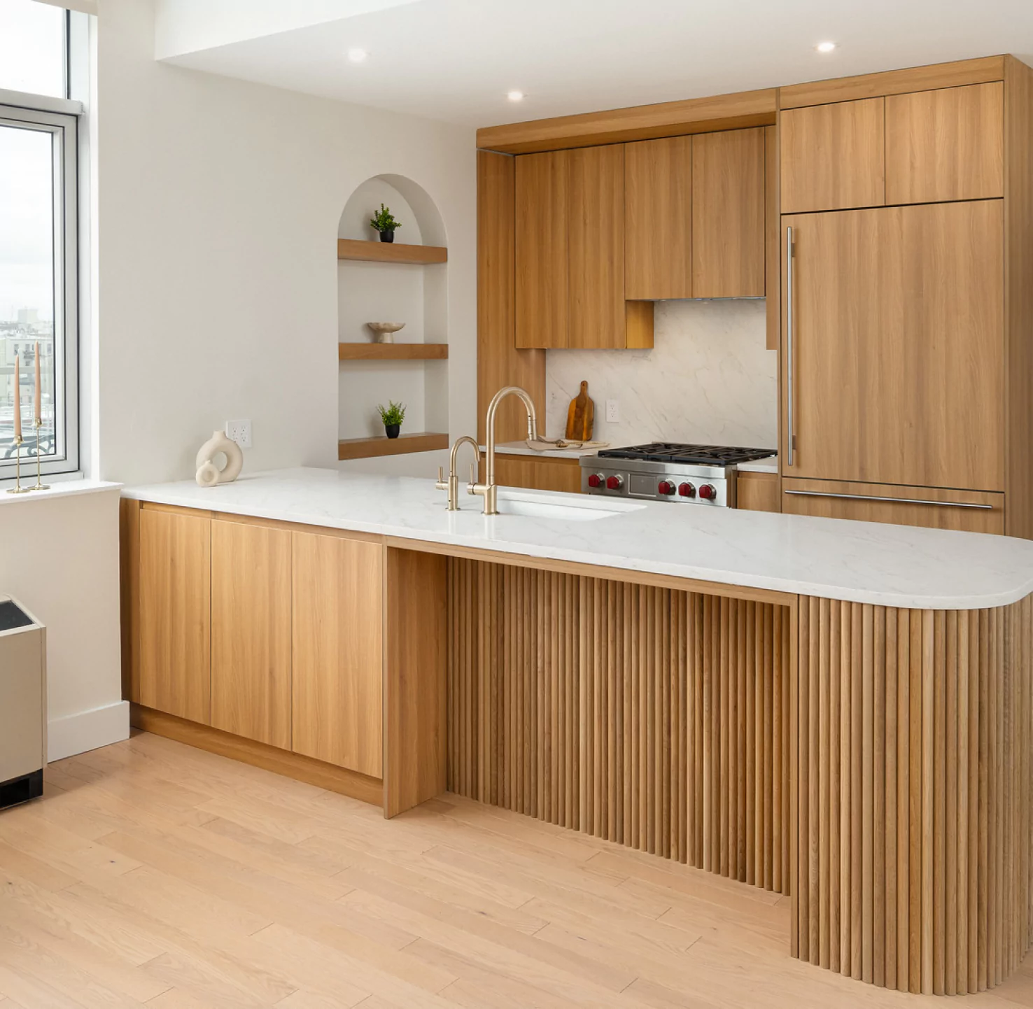 Finished NYC kitchen renovation by Chapter Renovation with custom cabinetry, integrated appliances, and bright natural light.