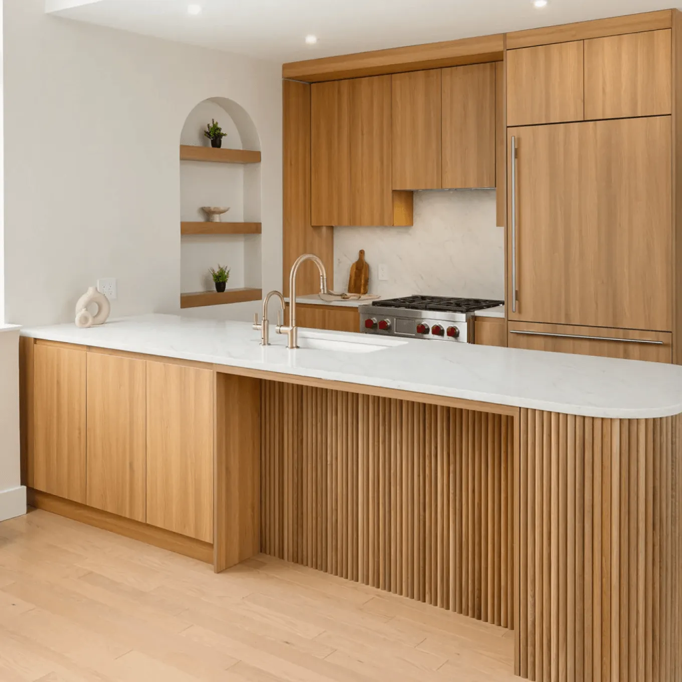 Modern kitchen renovation with contractor and homeowner discussing cabinetry samples and layout plans