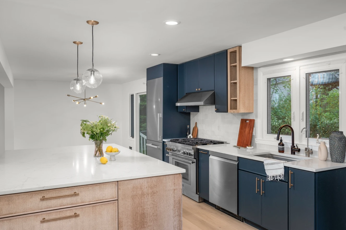 Open-concept living and kitchen in renovated Rye single family home with removed structural wall and family-focused layout