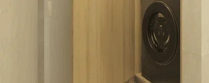 Custom millwork concealing laundry appliances in the Axis Brickell condo for a refined, built-in look.