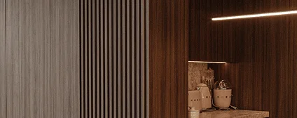 Textured wall paneling with concealed storage in a renovated Miami condo for a seamless aesthetic.