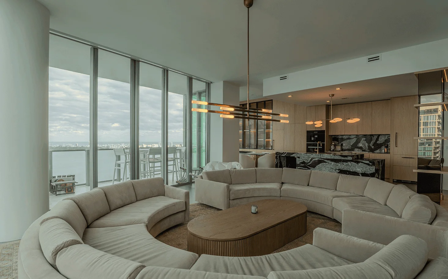 Clean modern interior with trimless doors, baseboards, and cohesive dark-toned design throughout luxury Miami condo