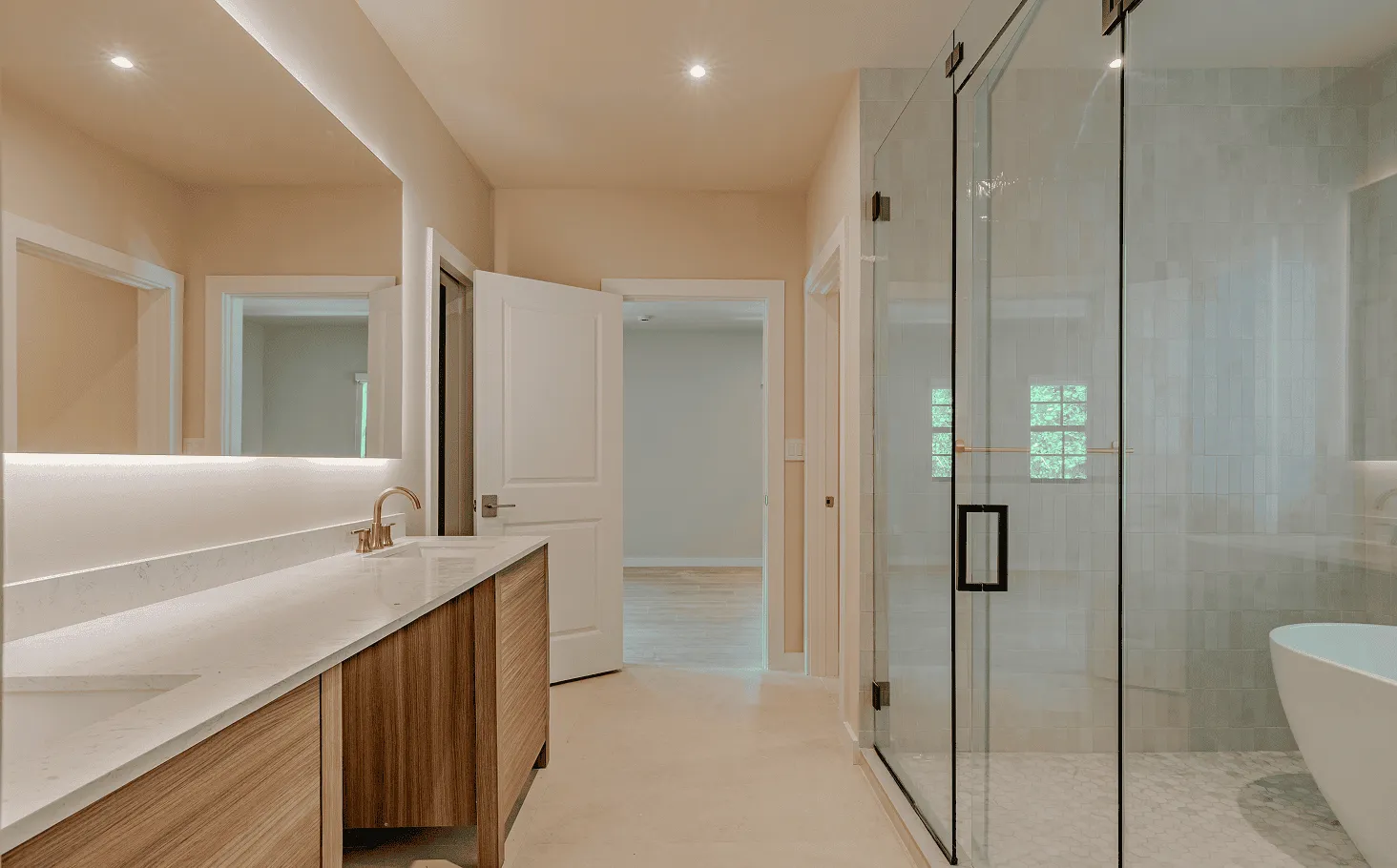 Luxurious master bathroom with colorful Spanish-style tiles, double vanity, and high-end fixtures