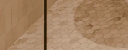 Contemporary tile flooring in warm tones throughout the renovated home