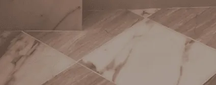 Luxurious marble tiles including Calacatta Gold, Nero Marquina, Calacatta Azurri, and Limestone used throughout bathrooms