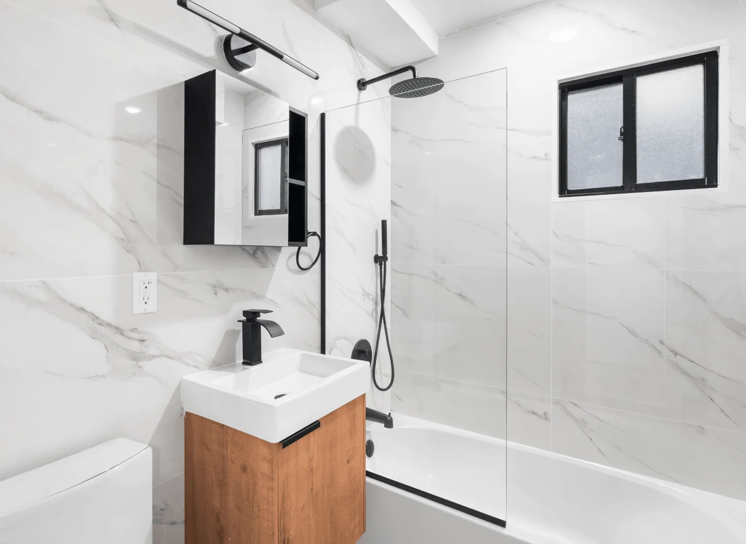 Union City bathroom one after renovation with upgraded finishes and flooring