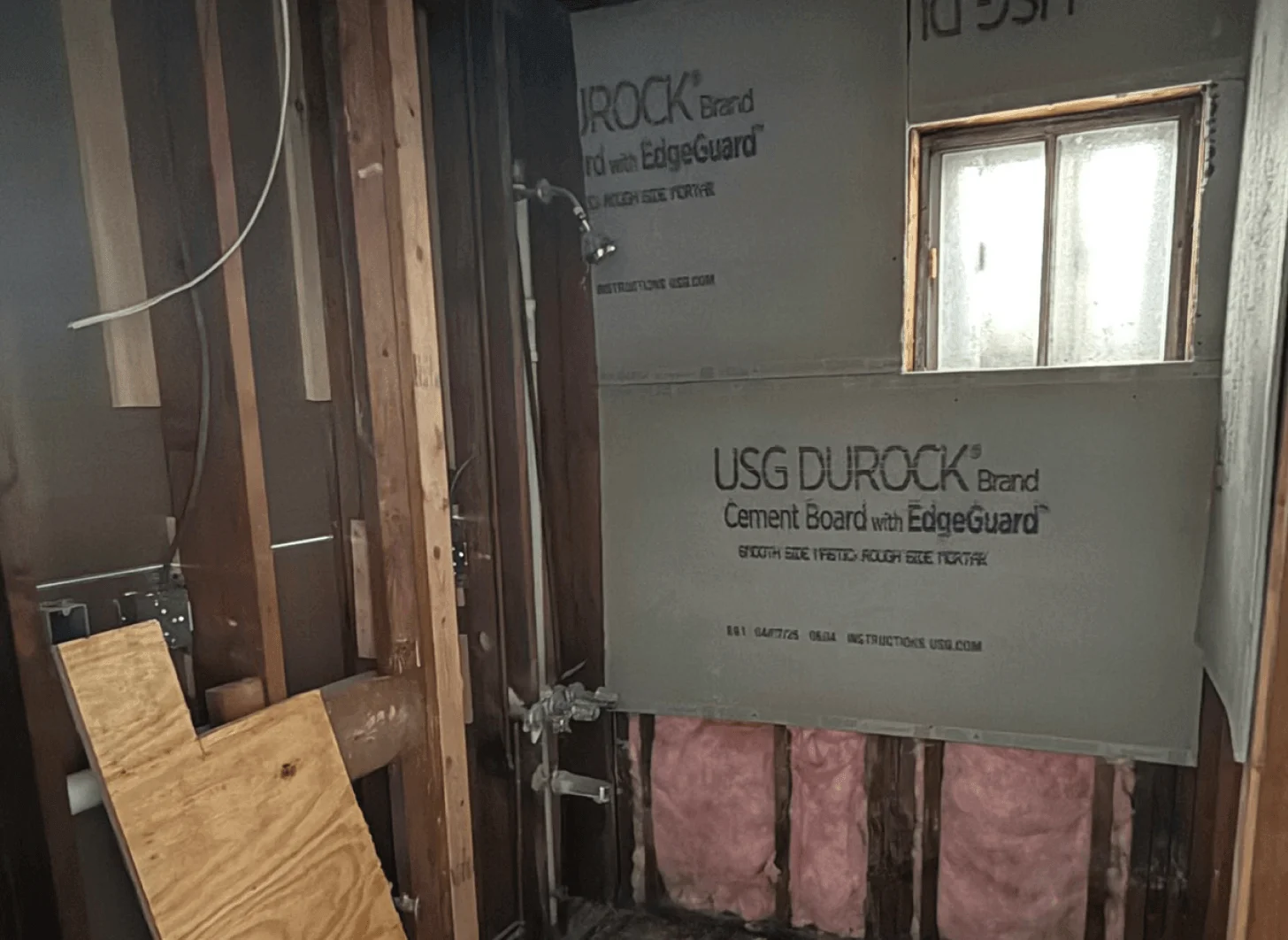 Union City bathroom one before renovation with plain surfaces and older finishes