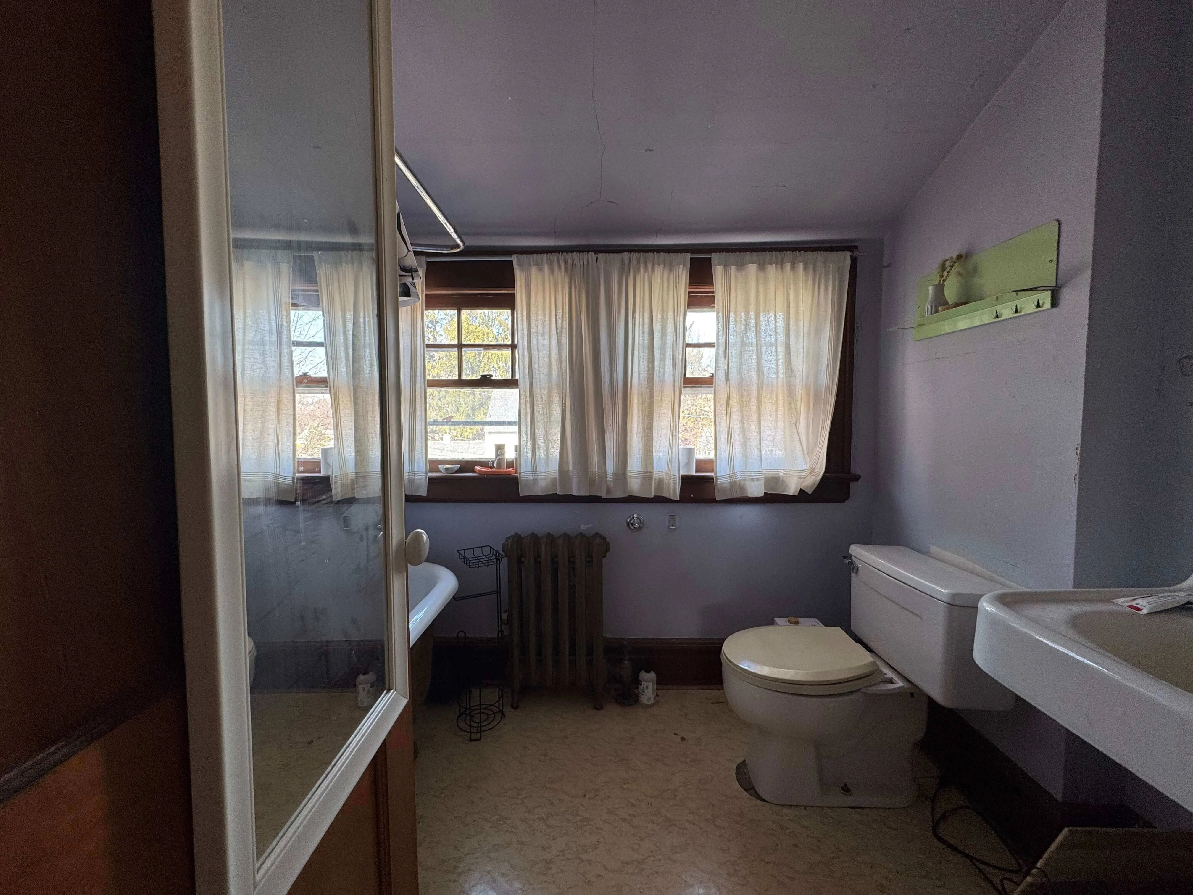 West Orange basement bathroom area before renovation with unfinished walls and basic layout