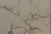 Marble-look shower wall tile with soft grey veining