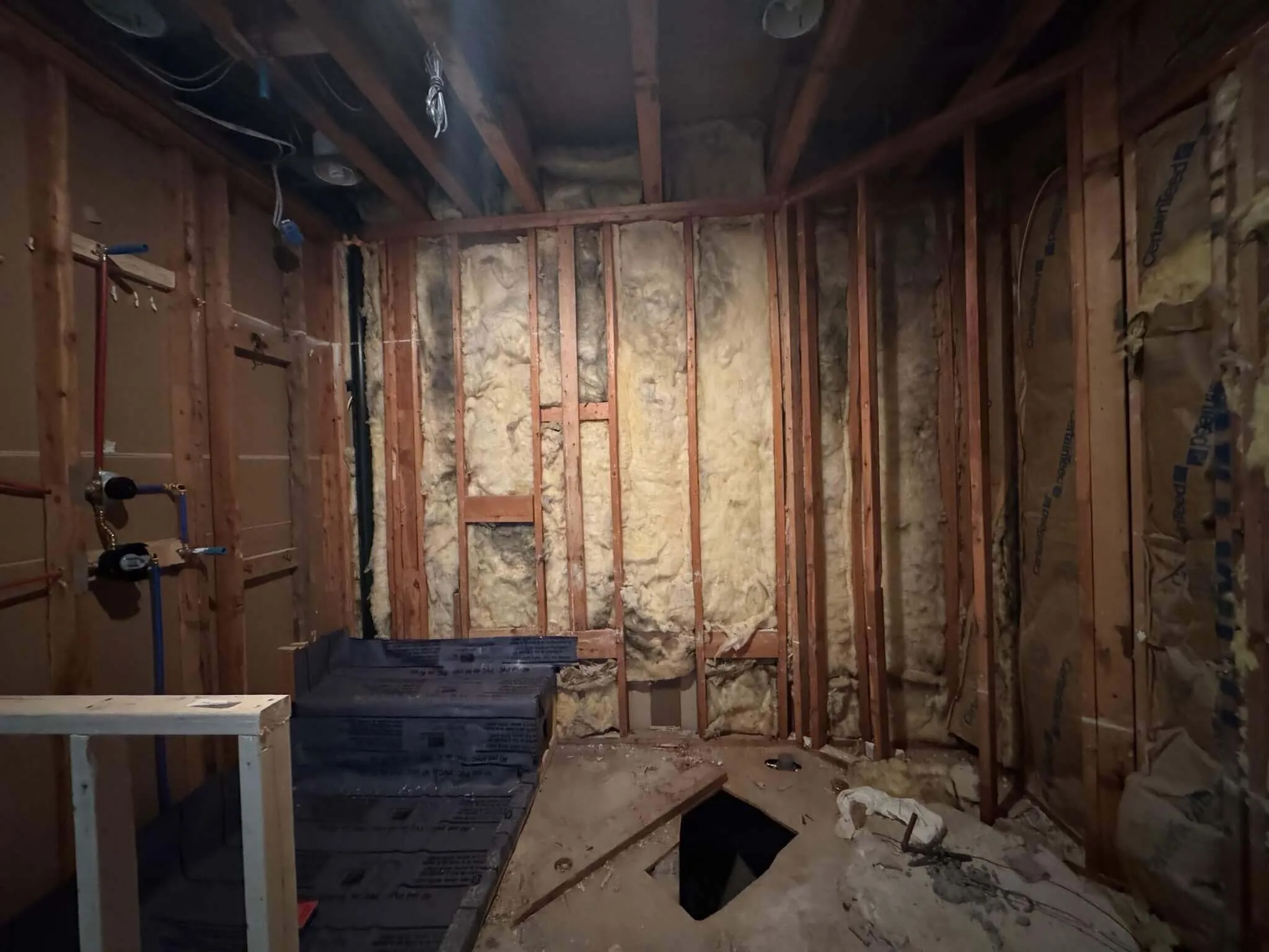 Before renovation of Rye Brook powder room with outdated vanity and fixtures