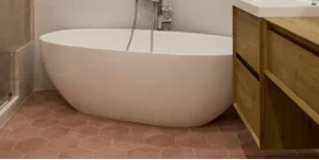 Freestanding sculptural bathtub installed as the focal point of the renovated Rye Brook primary bathroom