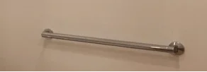 Discreetly integrated ADA-compliant grab bars in the renovated Rye Brook powder room