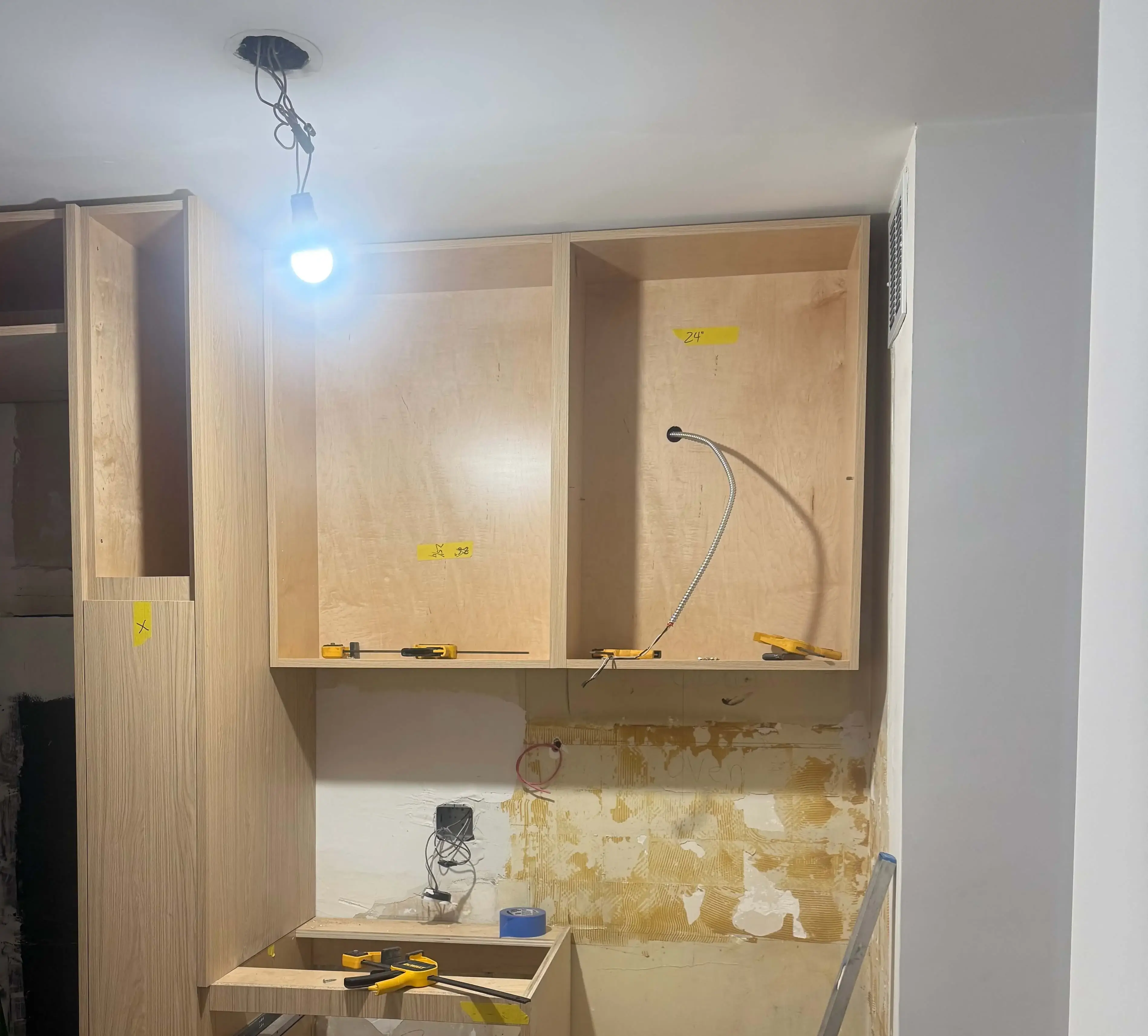Gramercy co-op kitchen before renovation with outdated cabinetry and finishes