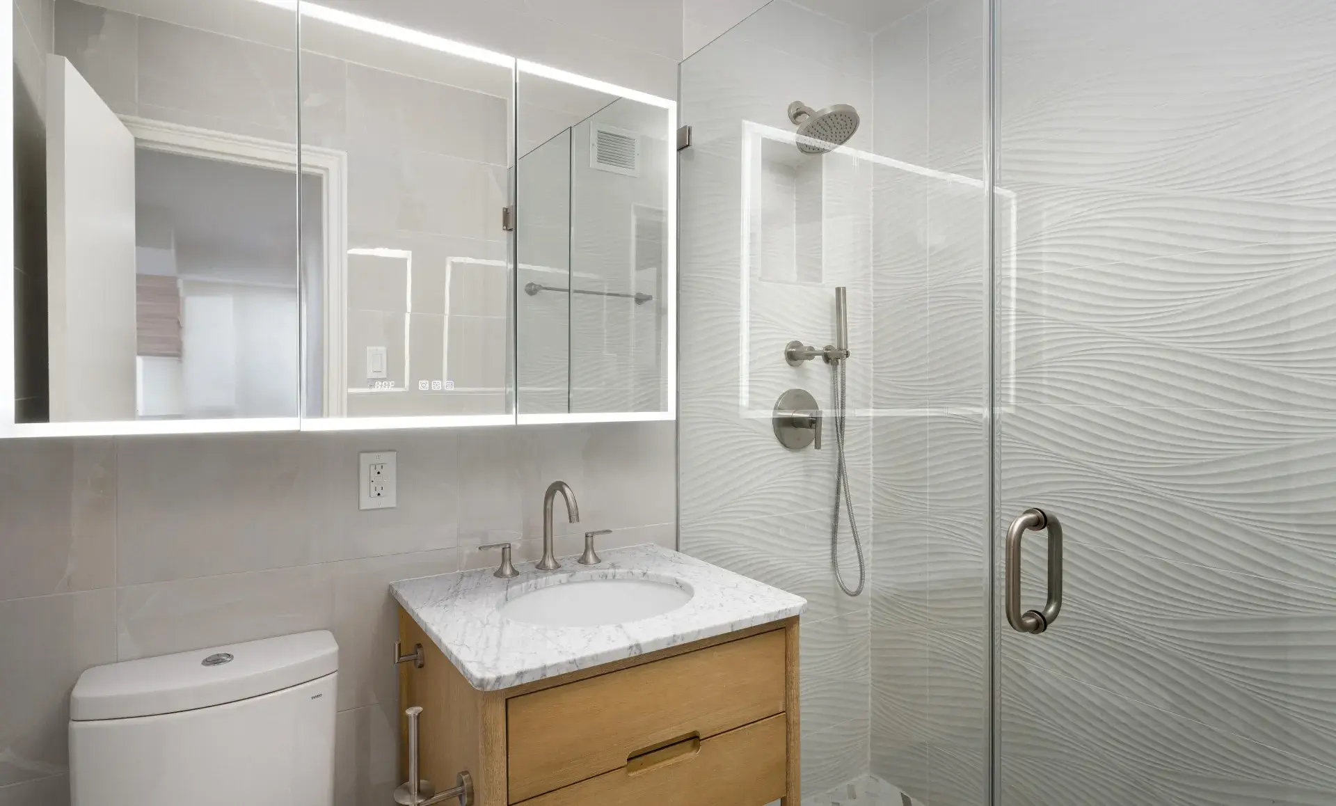 Greenwich Village apartment after renovation with natural wood cabinets