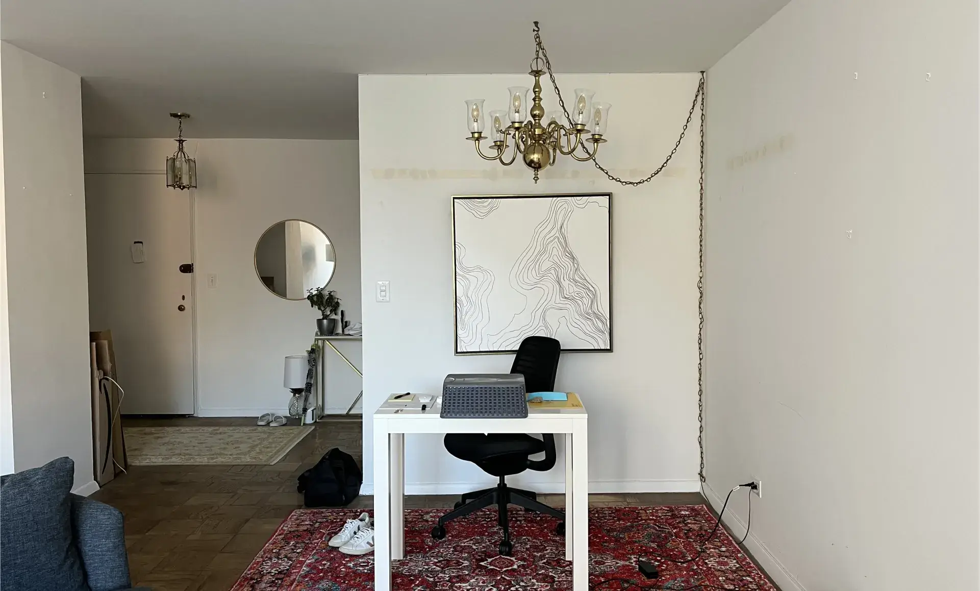 Greenwich Village apartment before renovation showing dark kitchen area