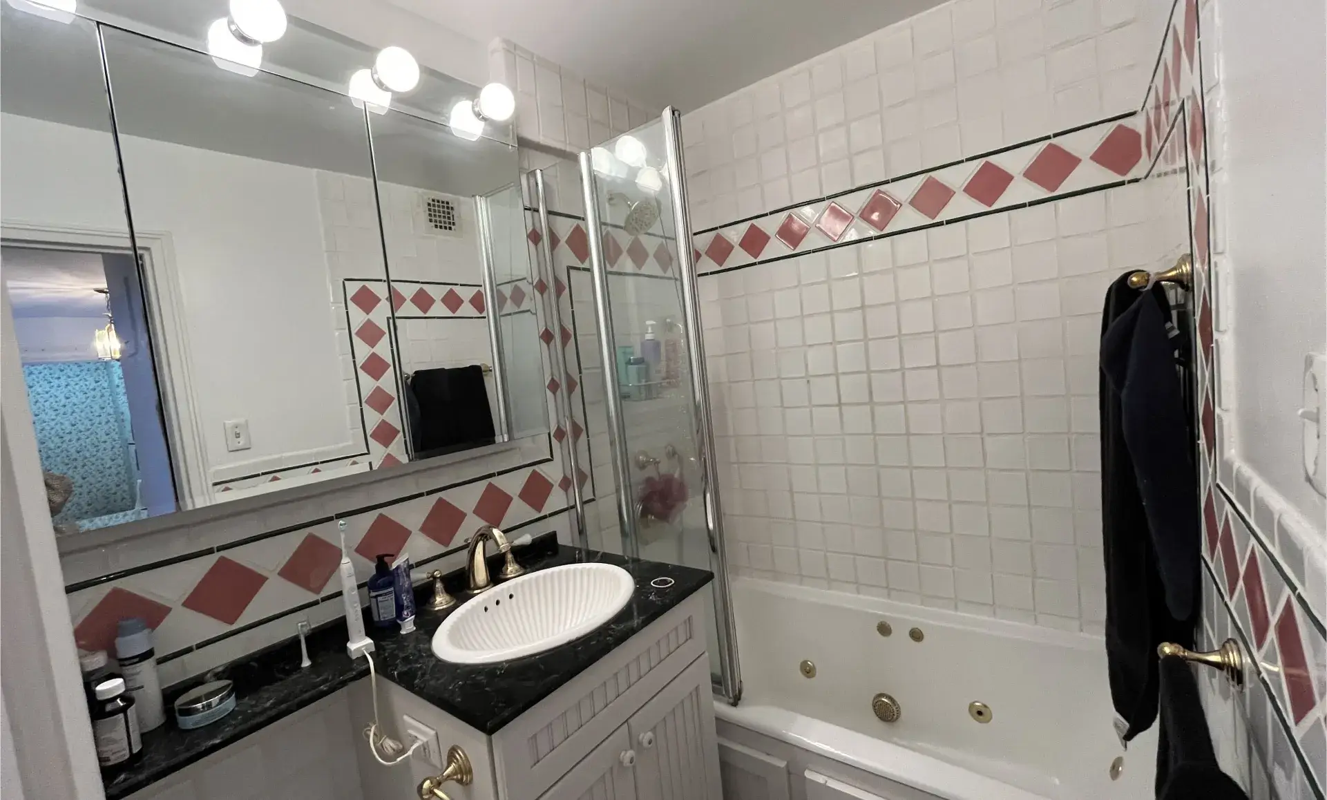 Greenwich Village apartment before renovation showing outdated cabinets