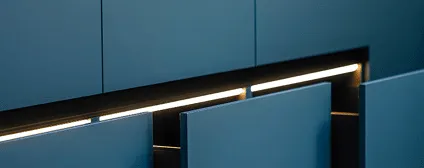 Custom deep blue cabinetry with recessed hardware in Jersey City kitchen renovation