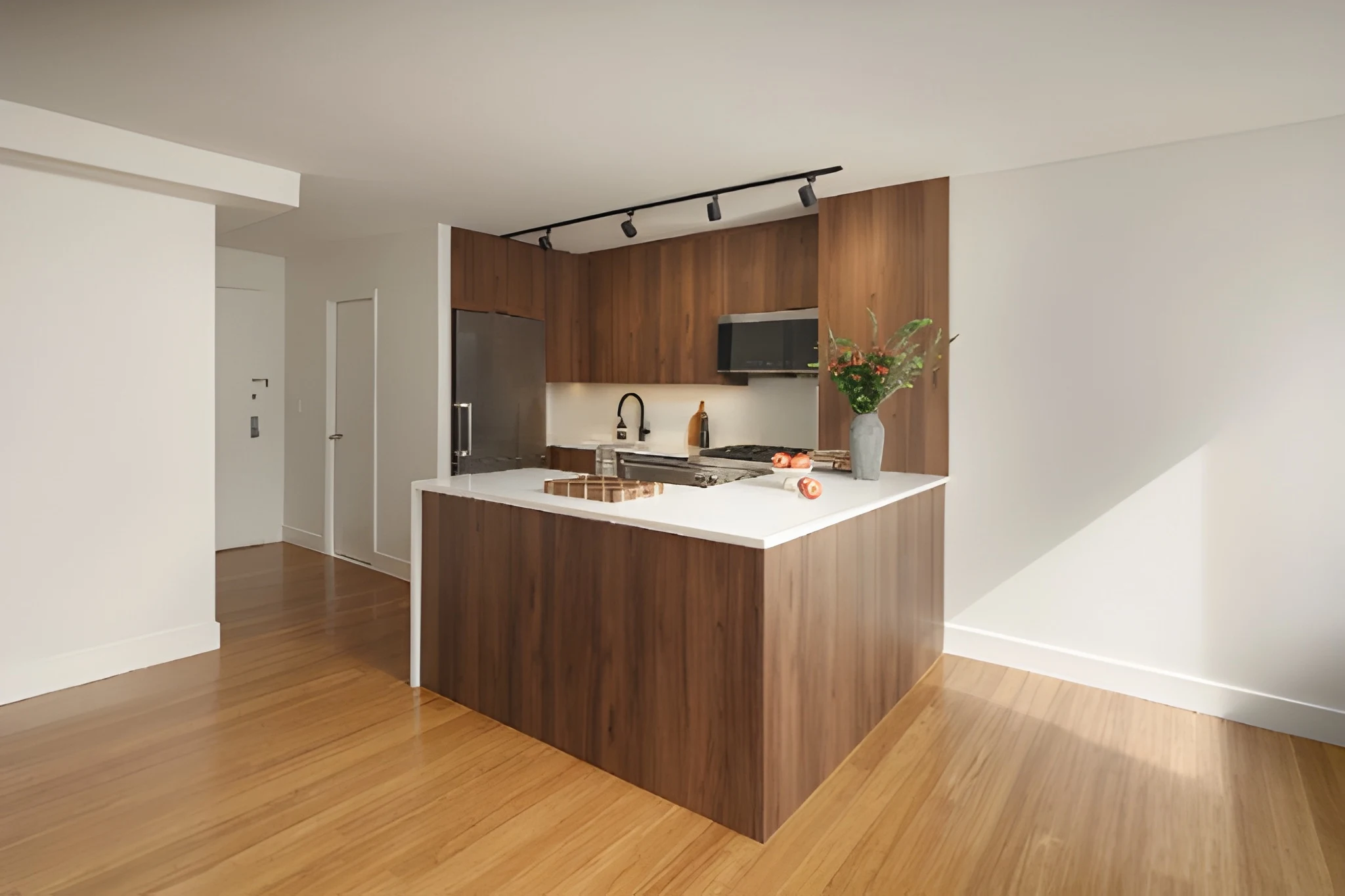 Renovated Midtown East kitchen island with dark wood base, white countertop, and stainless steel appliances