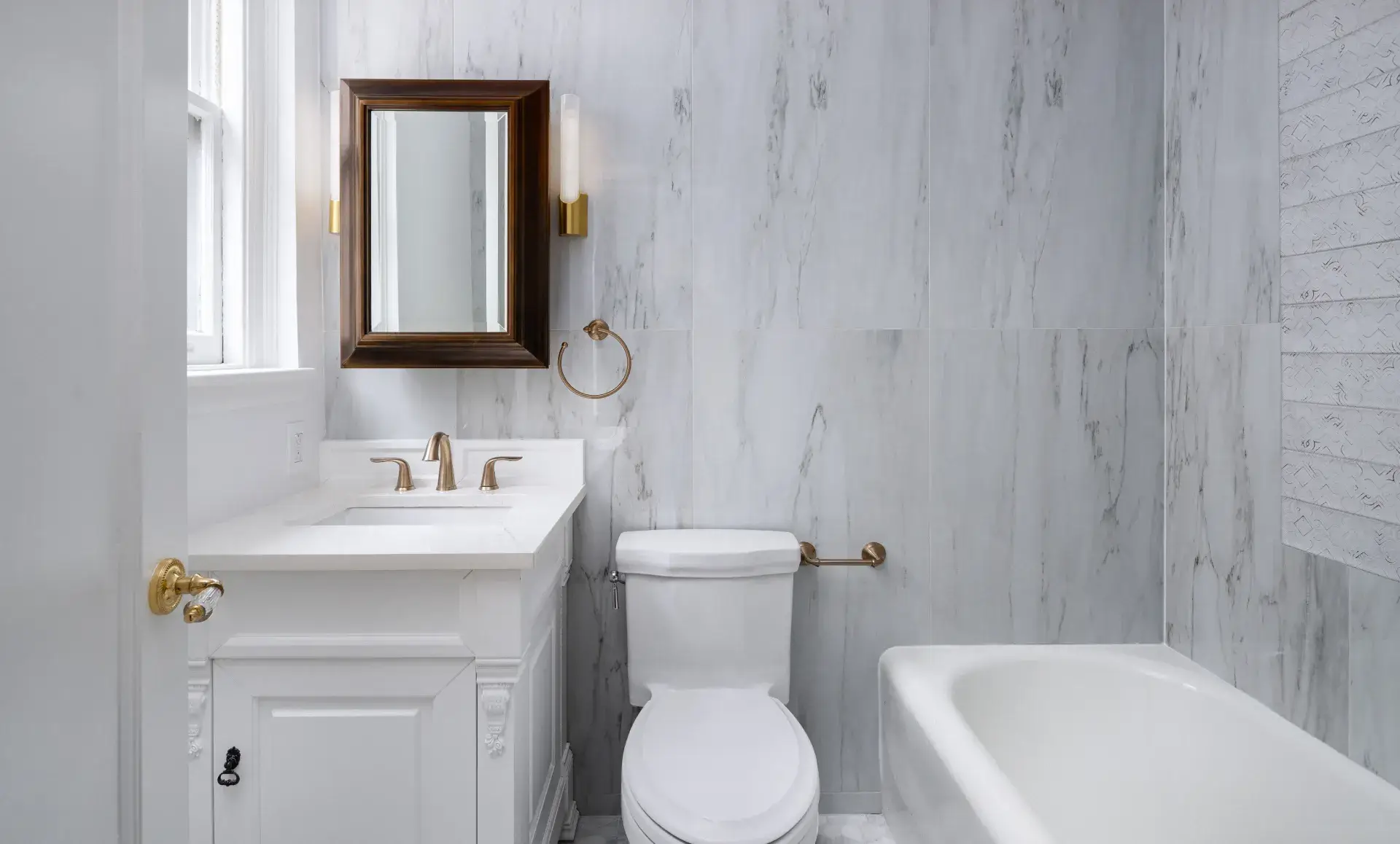 Midtown East apartment renovation living room with floral wallcovering and indigo accents