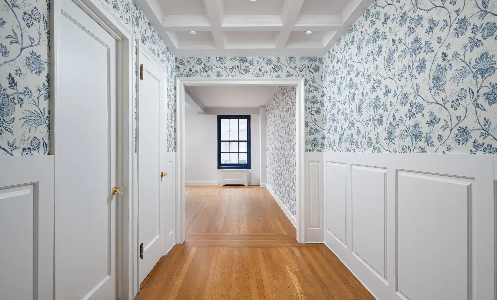 Midtown East apartment renovation primary bathroom with marble tiles and gold fixtures