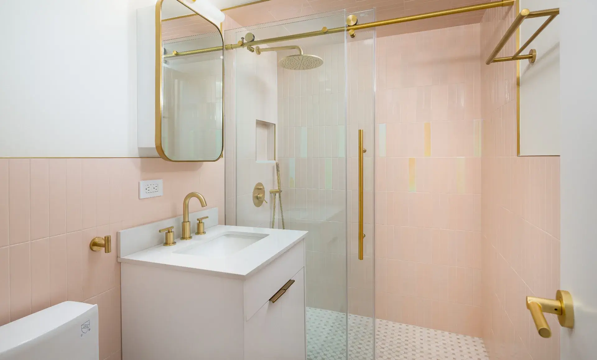 After renovation view of Manhattan studio apartment bathroom showing modern fixtures and finishes