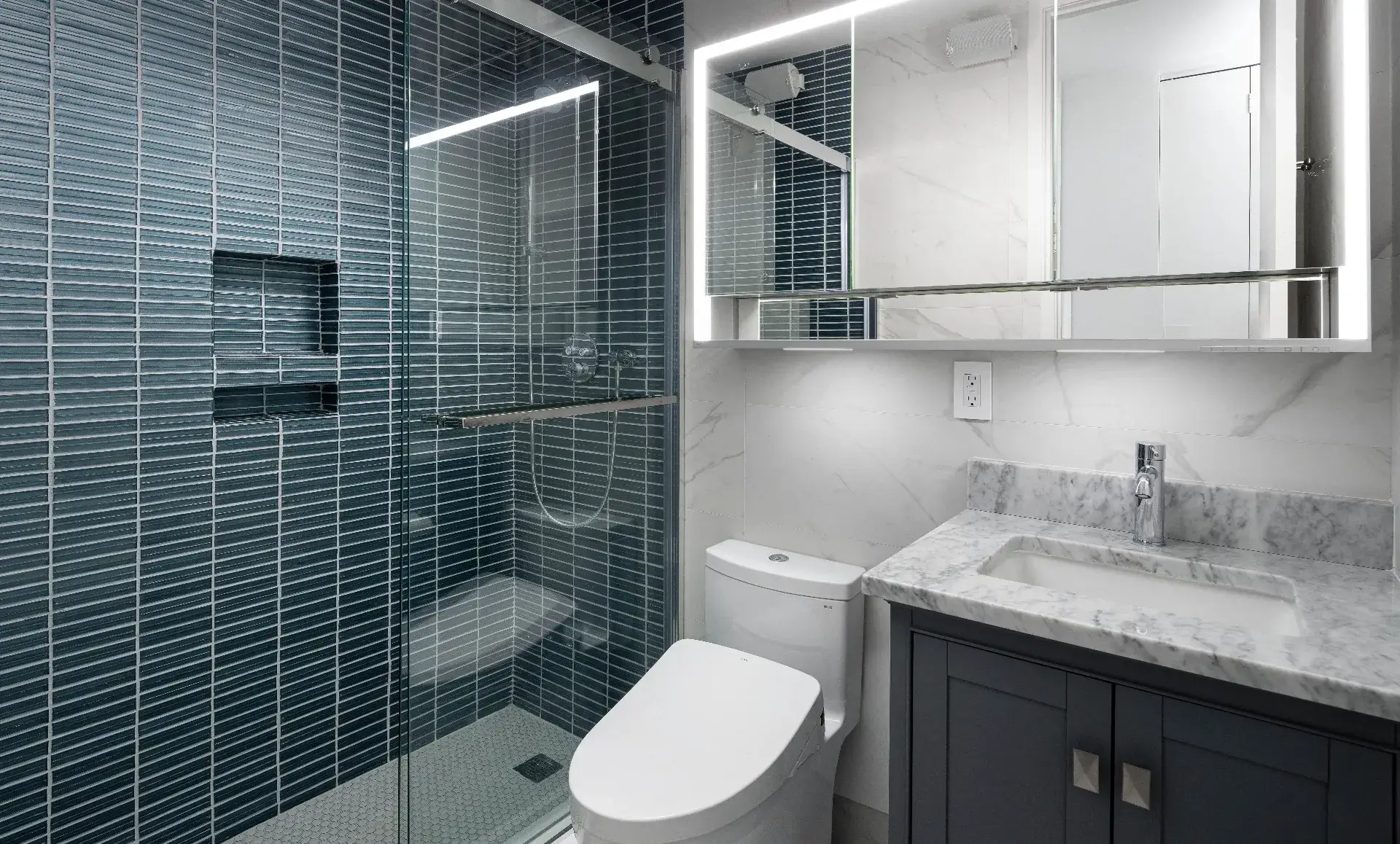 Manhattan condo bathroom after renovation with modern fixtures
