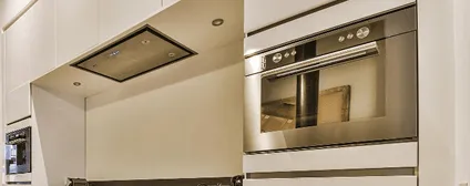 Integrated kitchen appliances in NYC tech headquarters office renovation