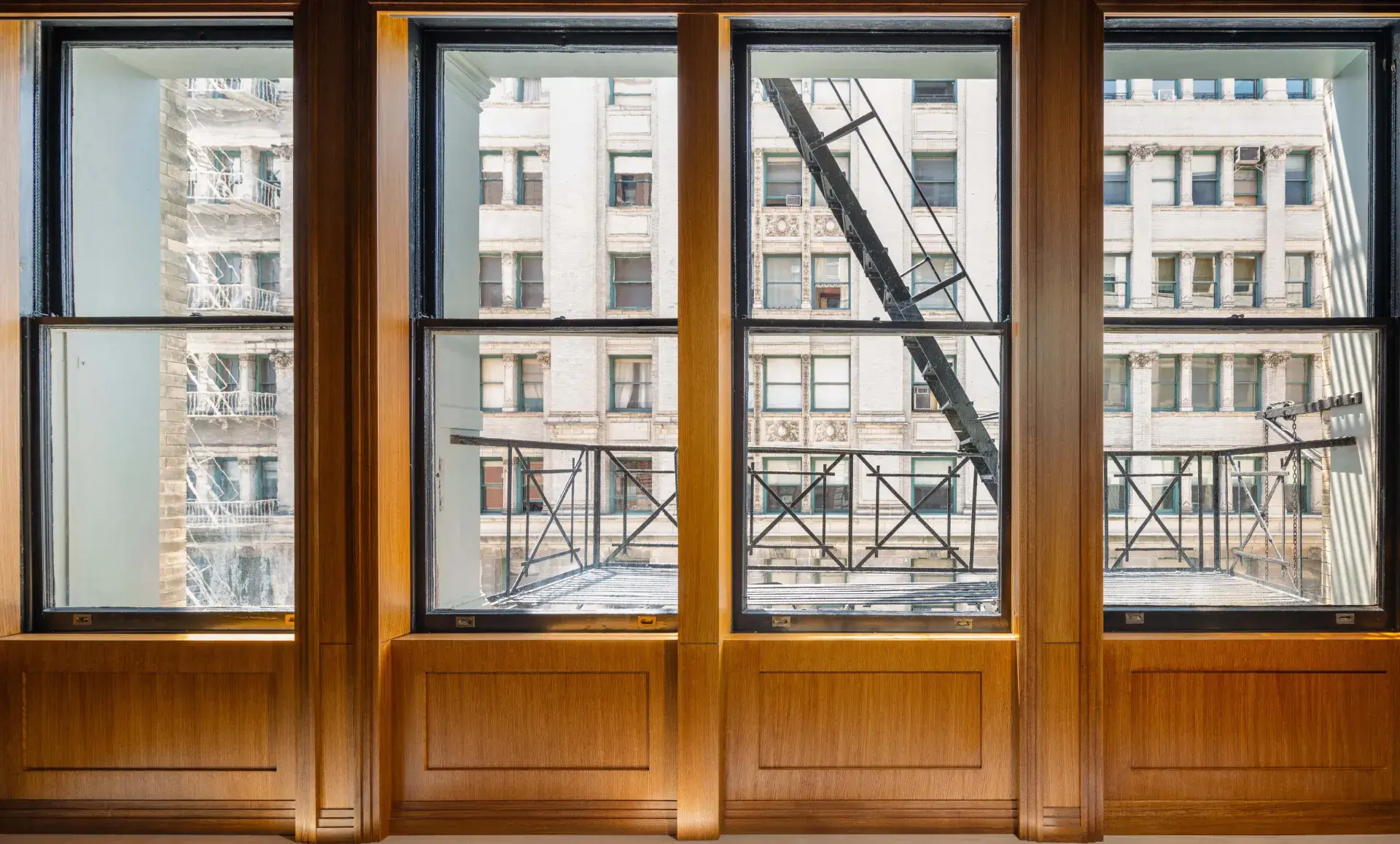 SoHo office renovation after photo showing modernized commercial space with recessed metal baseboard