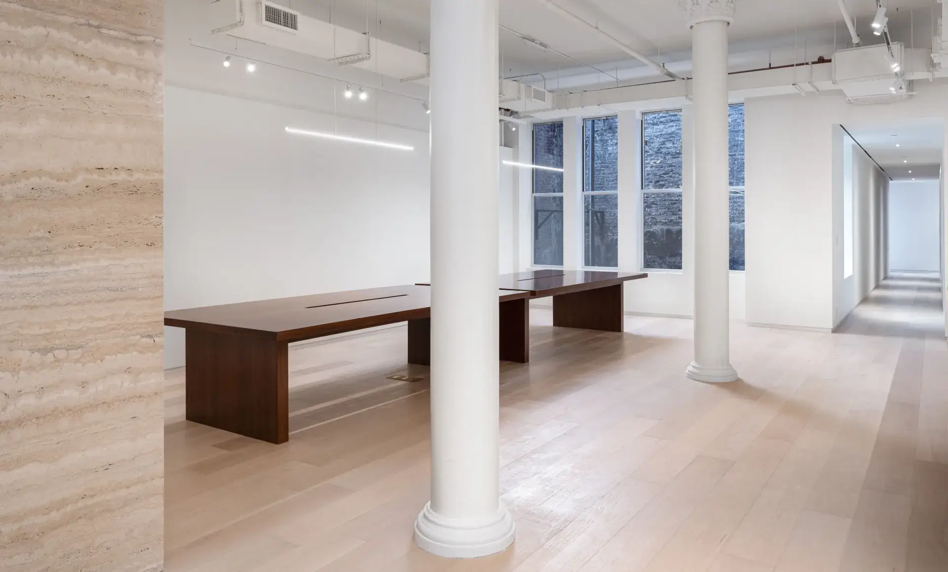 SoHo office renovation after photo showing elegant bathroom with earth-colored tiles