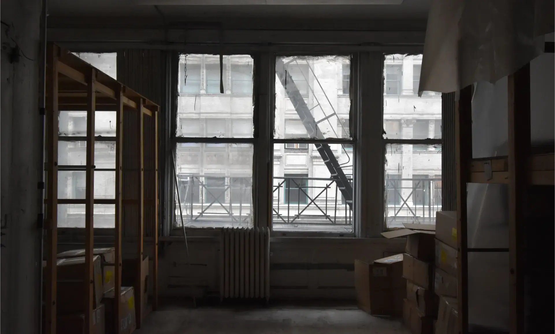 SoHo office renovation before photo showing outdated warehouse area