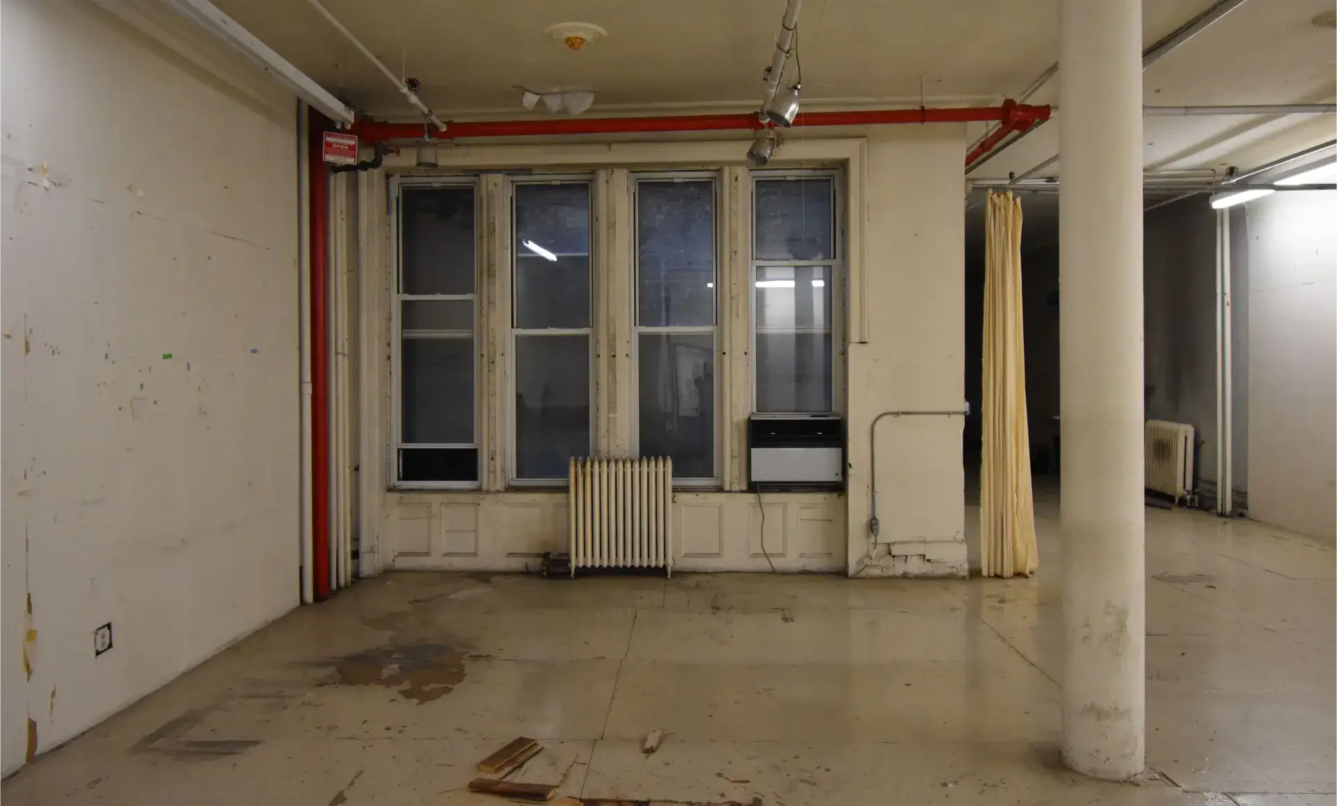 SoHo office renovation before photo showing basic standalone toilet
