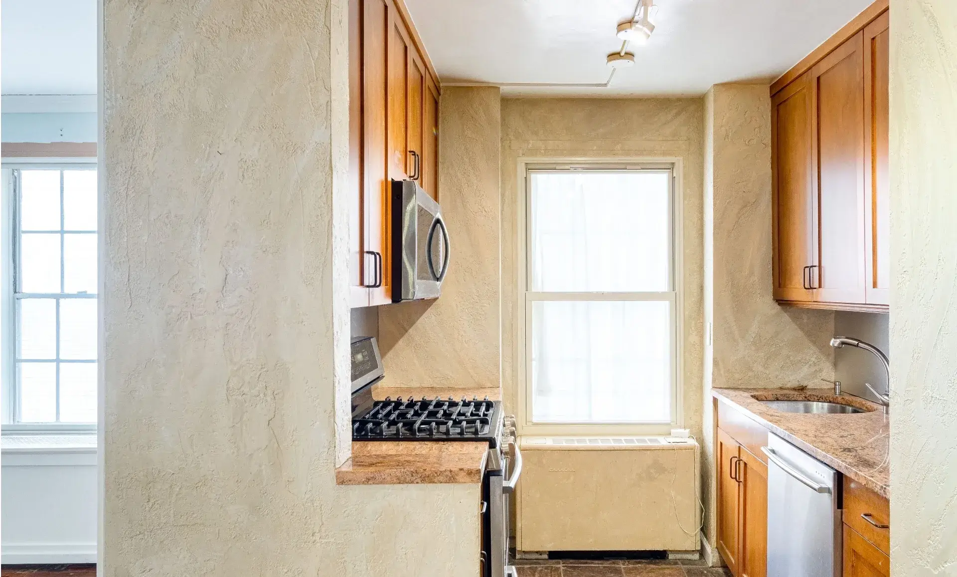 UES apartment renovation before photo showing outdated bathroom