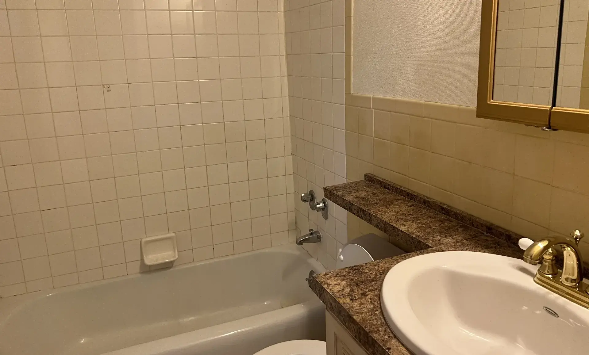 UES apartment before renovation showing outdated kitchen design