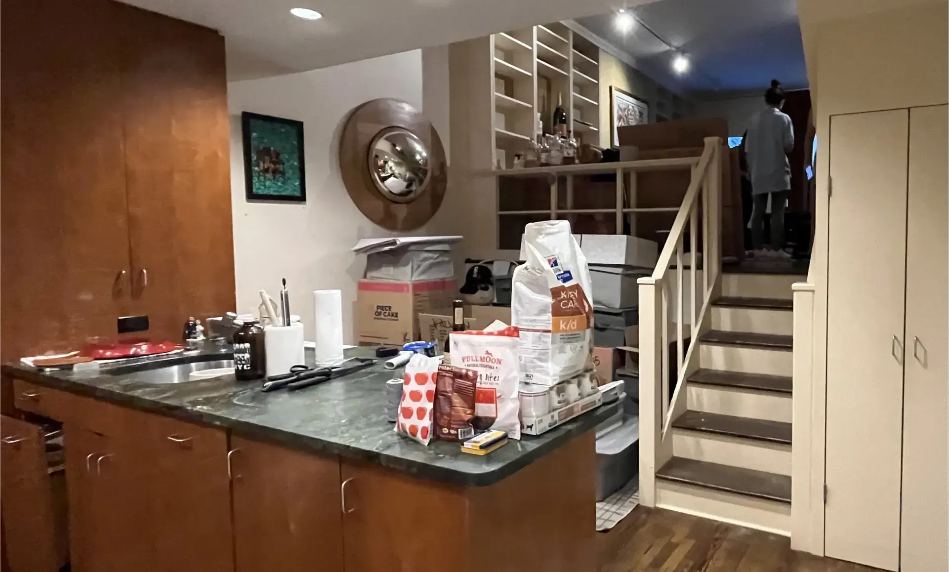 Triplex apartment renovation before photo showing outdated kitchen needing renovation