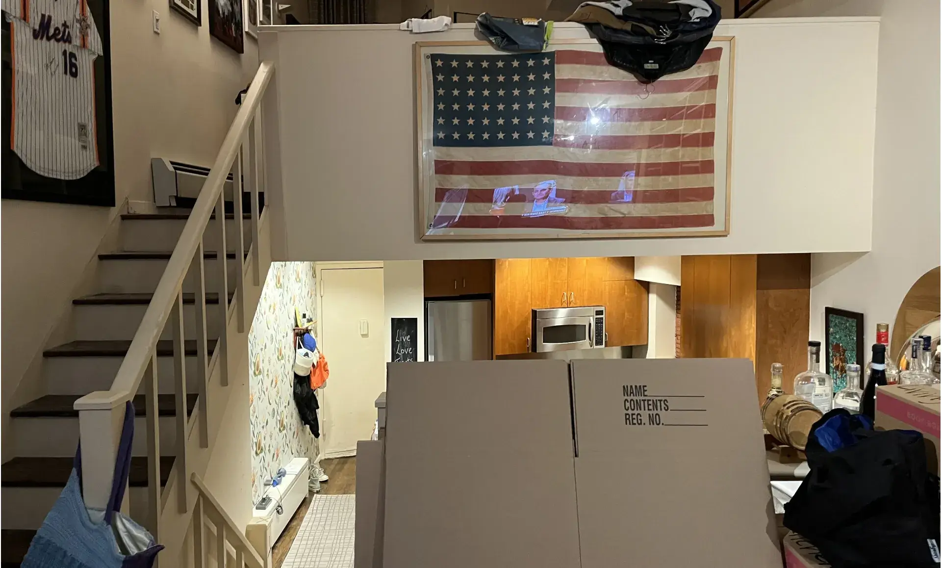 Triplex apartment renovation before photo showing outdated living room