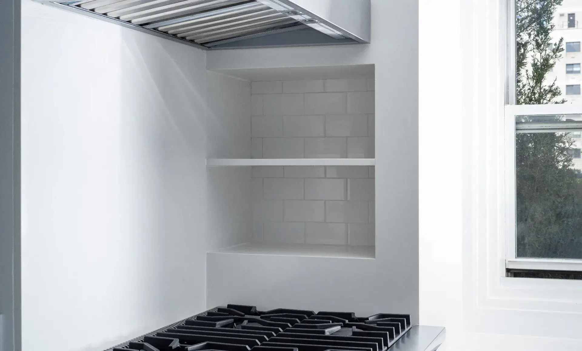 Upper East Side kitchen with slim pantry and refrigerator door integration