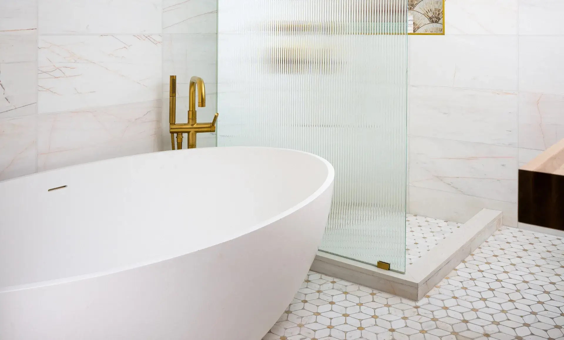 Luxury bathroom renovation in Williamsburg apartment with walk-in shower and brass fixtures